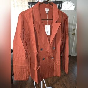 A new day. Women's brown blazer
